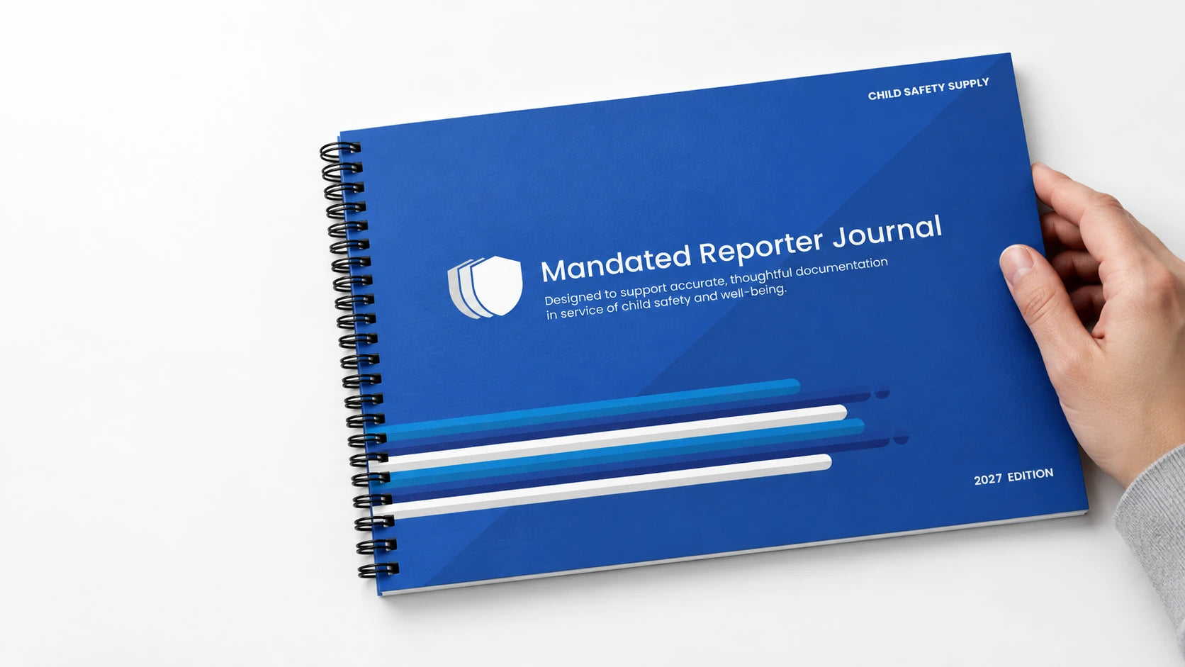 The landscape Mandated Reporter Journal with black spiral binding along the left edge